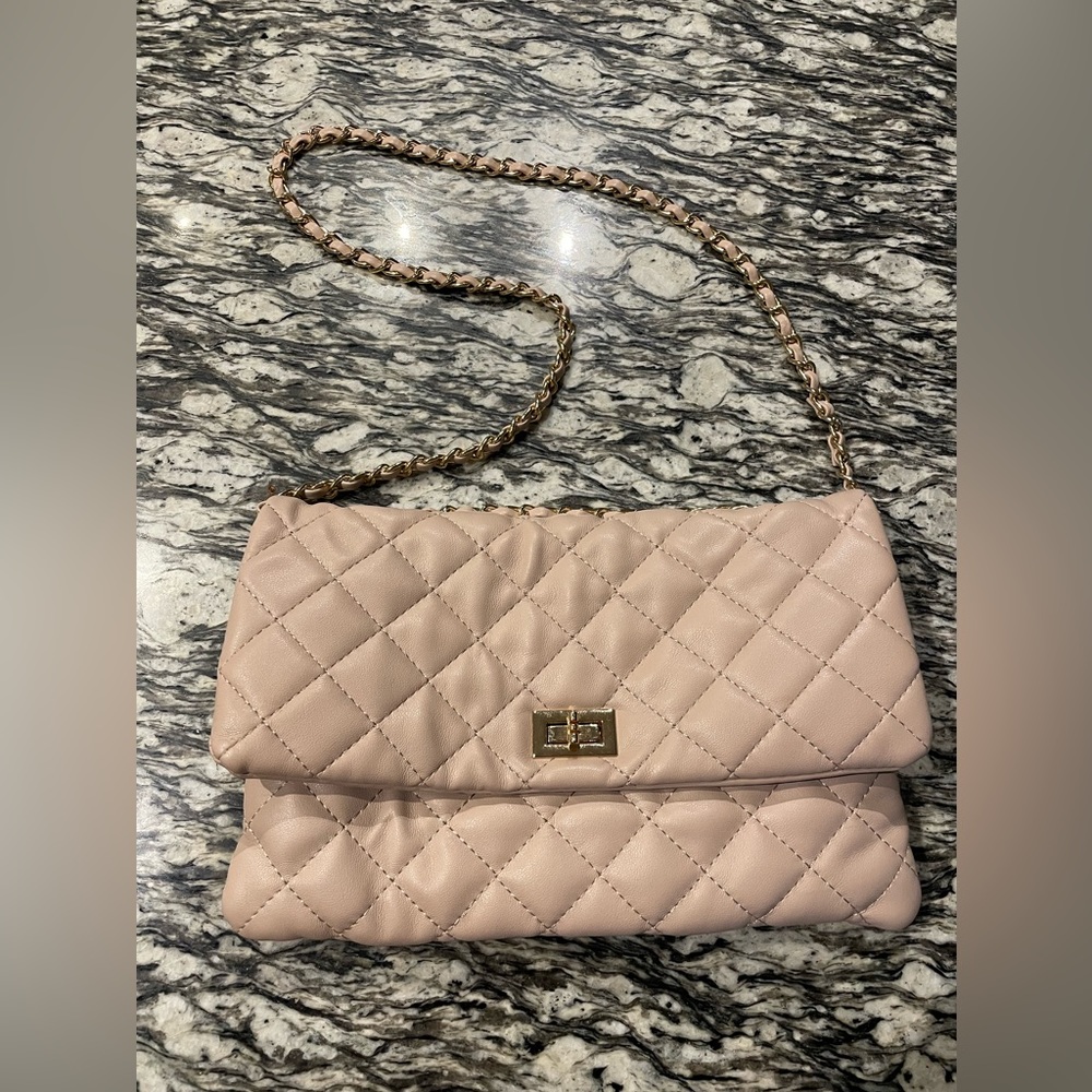 Pink quilted purse with gold details